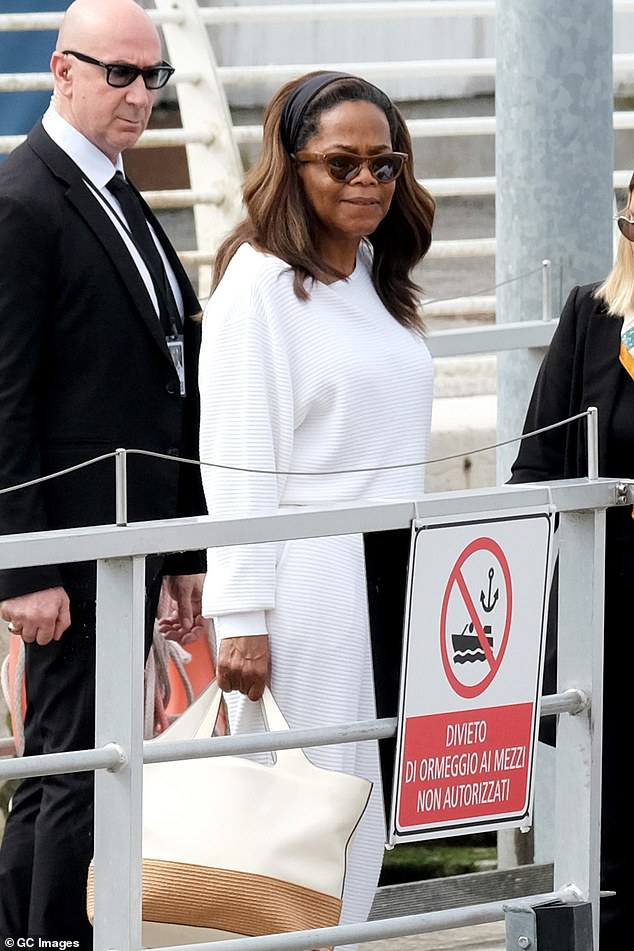 The billionaire went on to share an anecdote of how she helped the couple deal with a surprising backyard 'problem'; Oprah seen in June in Venice, Italy