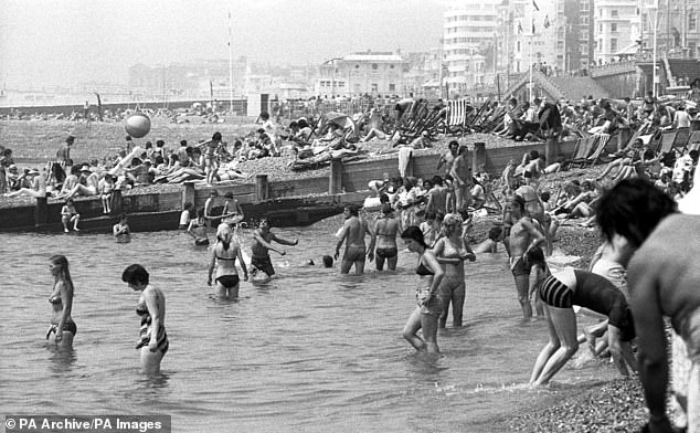 Britons enjoy the sun on Brighton beach during the heatwave of 1976