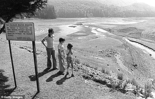 Residents surveying the Taf Fechan reservoir in South Wales during the drought of 1976