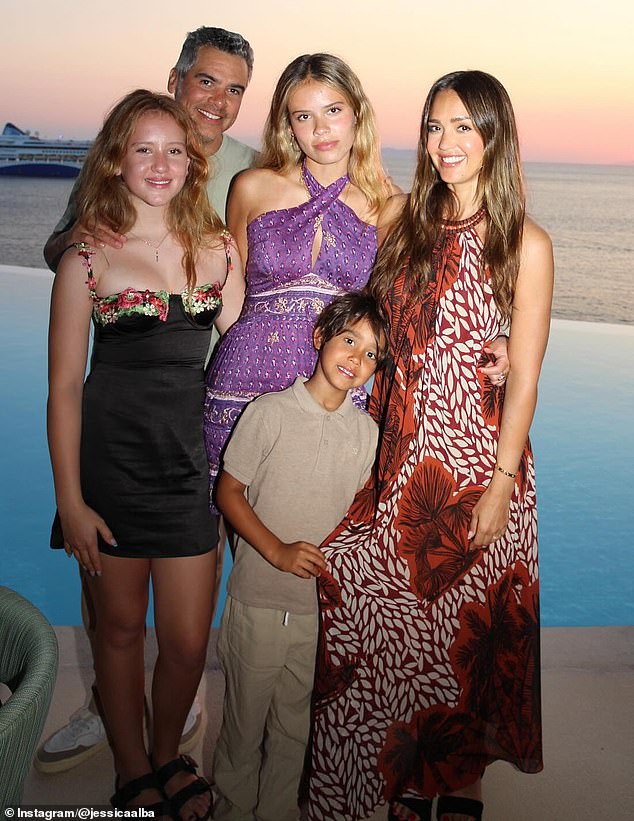 Alba pictured with Cash Warren (behind) and their three children Honor (center) Haven (left) and Hayes (front) in 2024. The pair split in January this year after 16 years of marriage