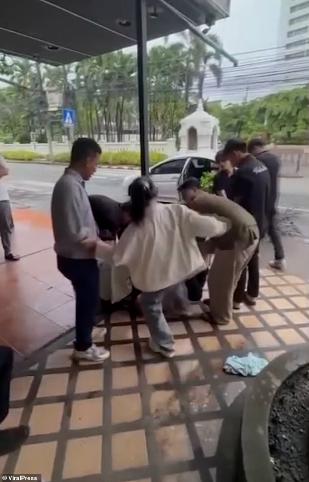 Video showed some of the bar workers kicking the man as he lay helplessly on the ground