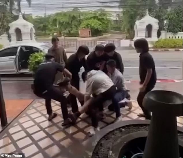 At one point they try to lift him up, with a woman heard screaming in the background