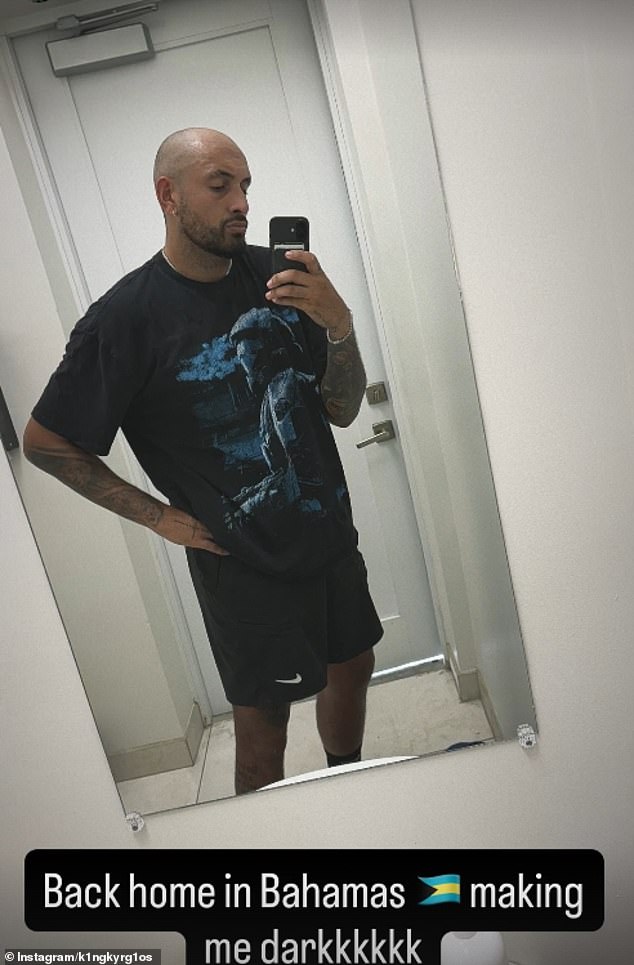 Nick also shared a second photo, this time a mirror selfie, that showed him looking pensive as he posed. 'Back home in the Bahamas. Making me darkkkkkk,' he wrote,