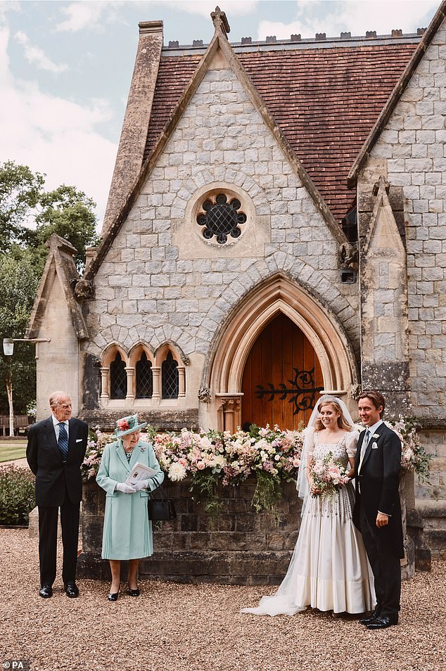 Socially distanced, Queen Elizabeth II and Prince Philip are pictured alongside Princess Beatrice and Edoardo Mapelli Mozzi outside the Royal Chapel of All Saints at Royal Lodge, Windsor, after their wedding