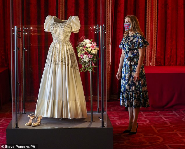 Princess Beatrice's loaned wedding dress on display at Windsor Castle in 2020, along with her shoes by Valentino