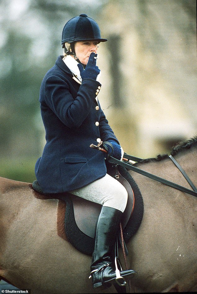 The future Queen smoking a cigarette on horseback