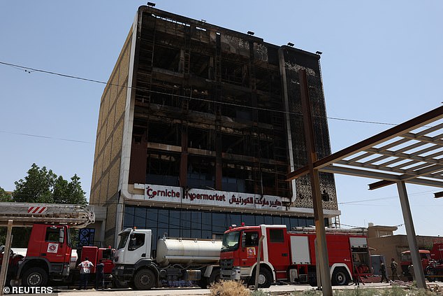 Chilling pictures of the aftermath this morning show the building completely blackened and burned out, with firefighters still at the scene