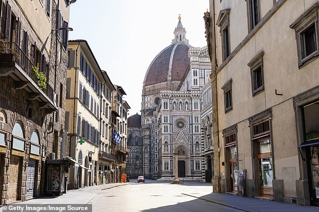 The image shows the Florence Cathedral, also known as the Basilica di Santa Maria del Fiore, at a time when the city wasn't overrun with tourists