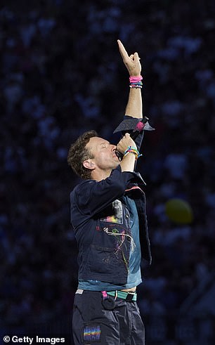 Chris Martin caught a couple by surprise as he addressed the audience at Coldplay's concert in Boston on Wednesday (Chris pictured last week)