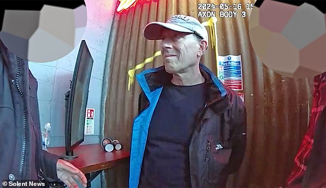 Bodycam footage shown to Mr Phillips' trial showing the moment he was arrested at a Costa coffee shop shortly after allegedly handing over a USB stick