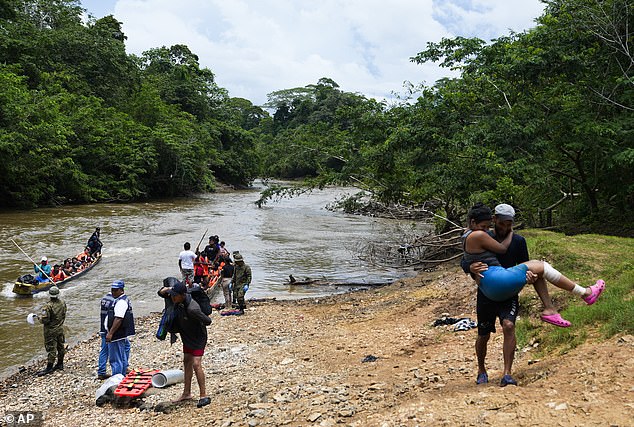Migrants heading north arrive by boat to Lajas Blancas, Darien province, Panama, Friday, Oct. 6, 2023, after walking across the Darien Gap from Colombia