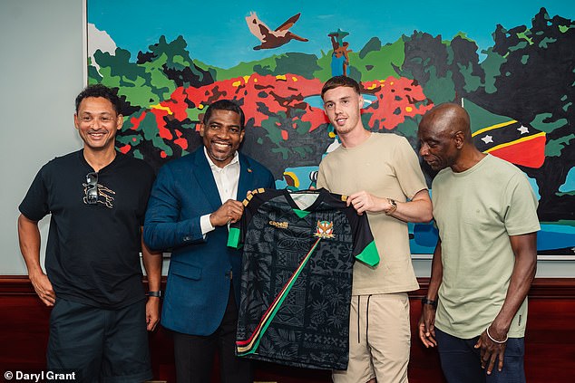 Palmer, his dad (furthest left) and grandad (furthest right) met with the prime minister Terrance Drew (second left), who gifted him a St Kitts national team jersey