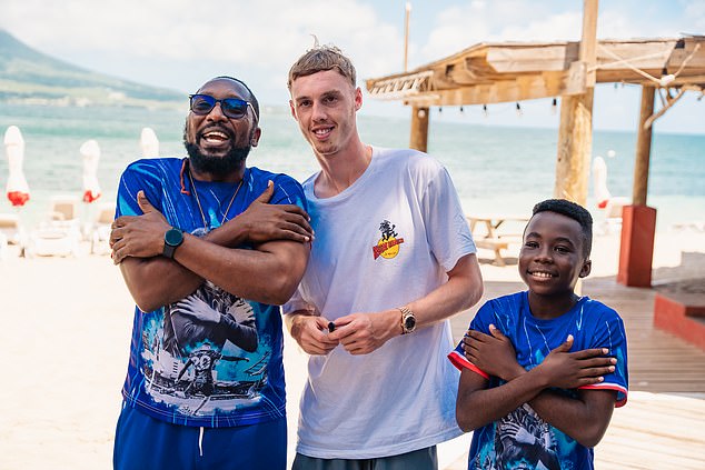 Palmer mets fans on the beach in St Kitts, and they replicated his 'Cold Palmer' celebration