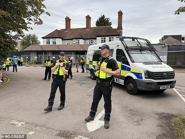 Essex Police were out in force in the picturesque commuter town - blocking the entrance to the hotel car park with a riot van