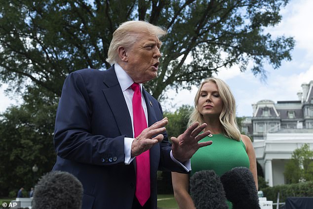 President Donald Trump speaks to the media as White House press secretary Karoline Leavitt, looks on