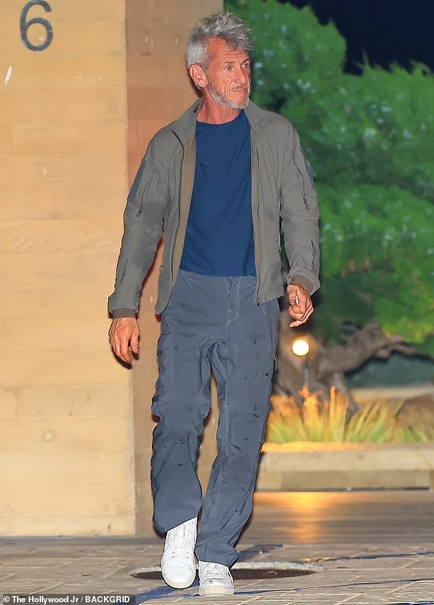 Also seen was Sean Penn, 64, who also sported gray hair as he wore an olive green shirt over a dark blue T-shirt with shiny charcoal gray cargo slacks