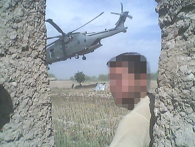 Frontline interpreter Jamil, 36, (face pixellated for his own security) out in the field in Afghanstan was one of those affected by the data leak