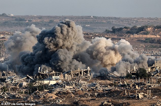 This picture taken from Israel's border with the Gaza Strip shows smoke billowing over destroyed buildings during an Israeli strike on the besieged Palestinian territory