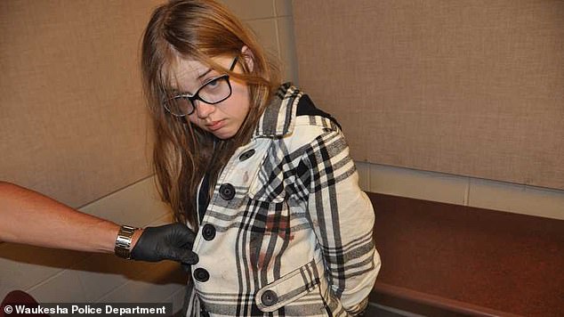 Geyser (pictured with blood on her clothes from the attack) told detectives at the time that she was 'forced to stab her best friend to death'