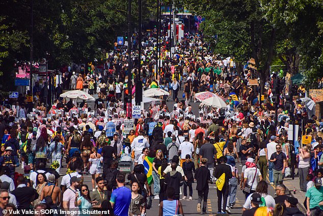 Pictured: Thousands of people on the streets during the second day of Notting Hill Carnival 2024