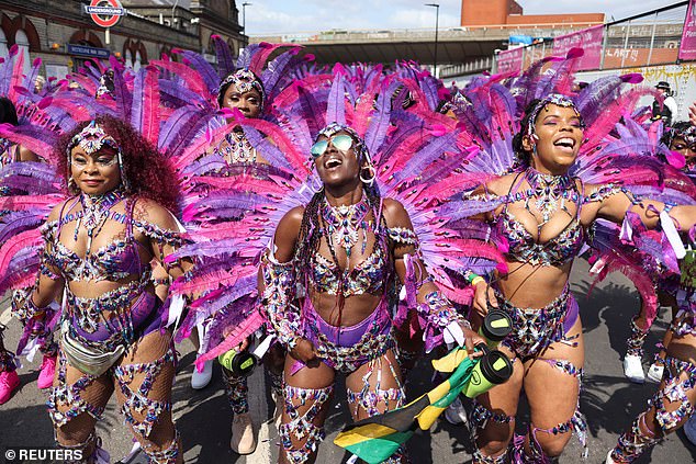 Senior officers believe it will make 'Carnival' - behind only Rio de Janeiro's celebration in terms of size - safer, but the plan has proved controversial with organisers and has raised civil liberty concerns (Pictured: Women at Notting Hill Carnival last year)