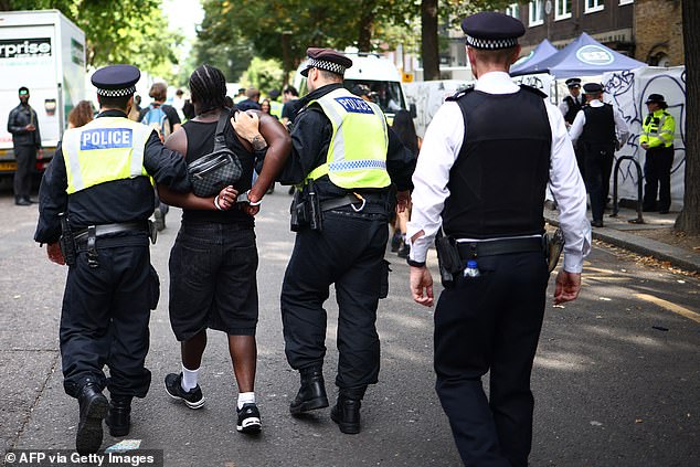 Pictured: Police officers make an arrest at the Notting Hill Carnival in west London on August 26, 2024