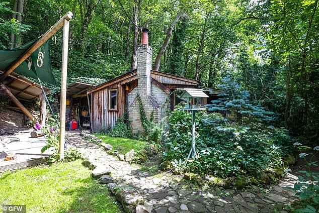 Spooky: The woods surrounding the two-bedroom cabin are said to be haunted by the evil spirit of Long Lonkin