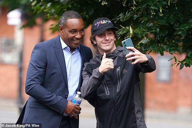 Paul Ince takes a selfie with a fan as he arrives at Chester Magistrates' Court charged with drink driving