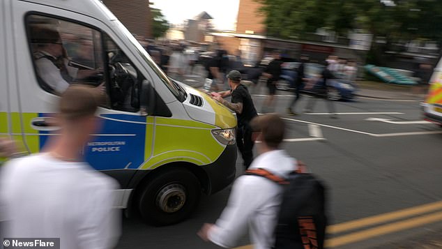 The is seen being shunted backwards by the police van as it continues down the road