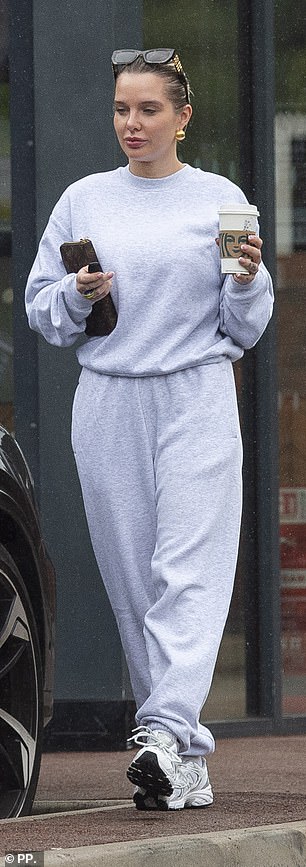 The stunner clutched onto her designer purse during the trip out
