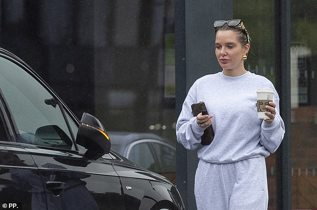 The blonde beauty certainly looked pleased to be reunited with her luxury Audi just weeks after ranting about the loss of her driving licence