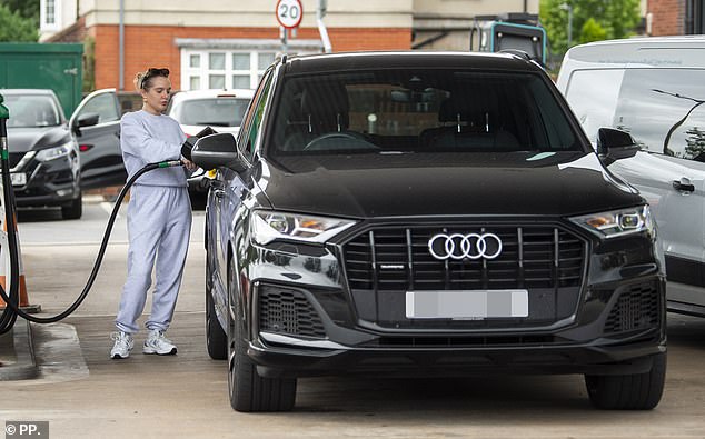 Helen is seen filling up her luxury vehicle