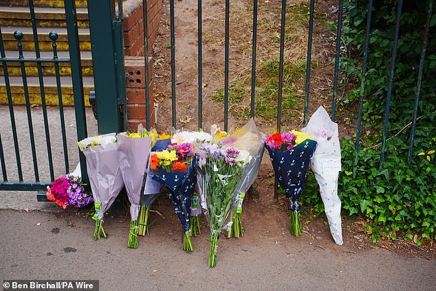 Flowers were left outside the school after a child died and several people were serious injuried after the coach overturned