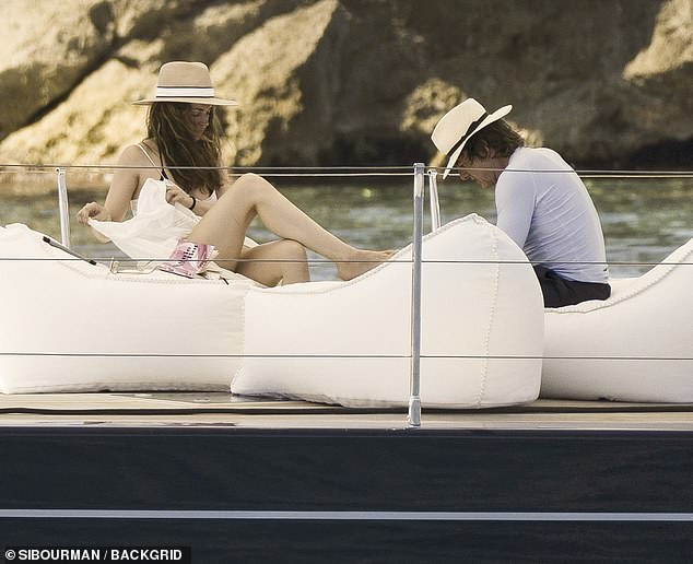 The Hollywood icon, 63, and the Blonde star, 37, who were first linked in February , looked smitten as they relaxed at sea in each other's company - with an insider dishing on romantic Cruise's generosity towards his new partner