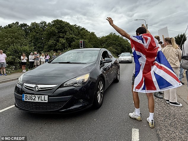 Beyond Union Jacks - others held a flag of St George with the slogan written in black: ¿Save Our Kids¿