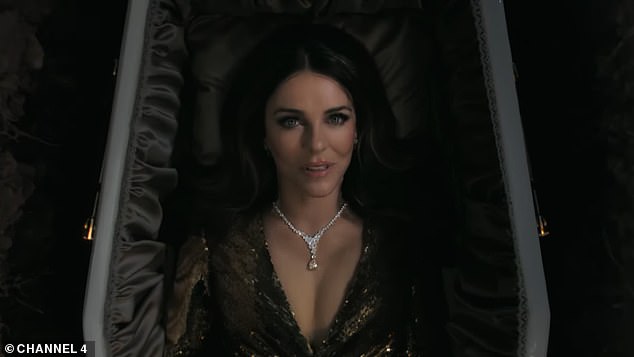 The actress stunned in a daringly plunging gold sequinned gown as she appeared deceased and dripping in diamonds