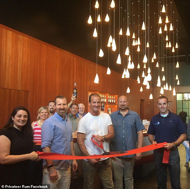 Kristin¿s now-deleted LinkedIn account showed that she has served as an ¿advisory board member¿ at Privateer Rum since September 2020. Pictured: Andrew Cabot (center) at a ribbon cutting celebrating Privateer Rum joining the Greater Newburyport Chamber of Commerce