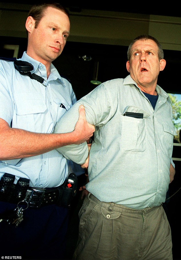 Murdoch being arrested by South Australian police in Adelaide in November 2003, more than two years after he murdered Peter
