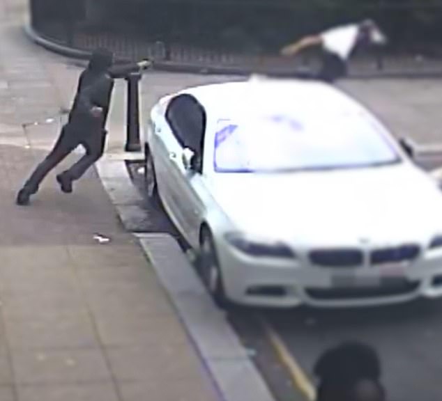 The suspect pulled out his gun and shot at the second victim from behind the car