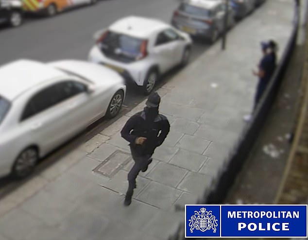 The balaclava-clad suspect can be seen sprinting down a busy street with the handgun
