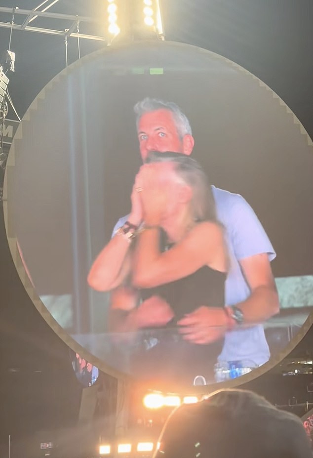 The couple were seen covering their faces, with Byron, the head of the AI startup Astronomer, diving out of view and Cabot turning away from the camera