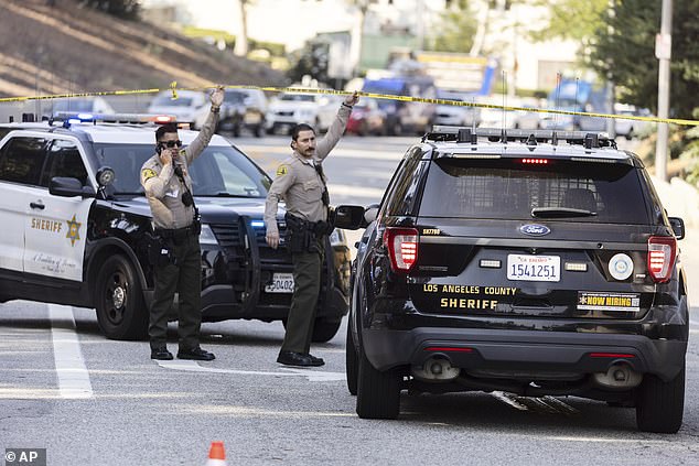 Sheriff's deputies are seen evacuating the surrounding roads after the explosion on Friday