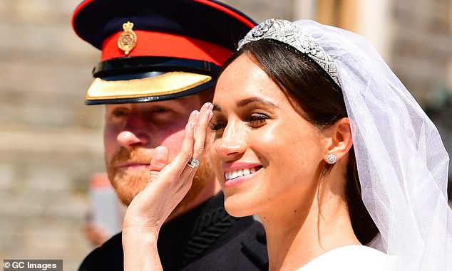 Prince Harry and Meghan Markle on their wedding day. The Queen was allegedly dismayed that Harry had asked the Archbishop of Canterbury to perform the wedding service in St George¿s Chapel without first requesting permission from the Dean of Windsor