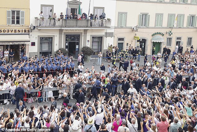 Pope Leo XIV greets the faithful as he leaves the church of St. Thomas of Villanova where he celebrated a Mass, at his summer residence in Castel Gandolfo, Italy, earlier this week