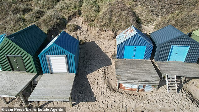 The piece of land is on the market with Elvins Estate Agents who say it 'beautiful panoramic views across the bay towards St Tudwals Islands and Machroes Beach'