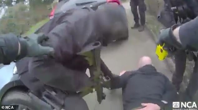 He was summoned out of the car before armed officers arrested him
