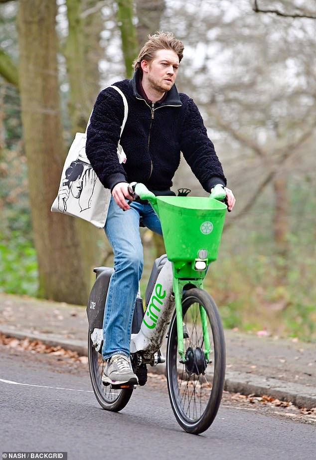 Joe Alwyn was spotted looking less than merry in December last year as he was seen riding a Lime bike on Boxing Day