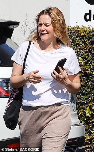 Alicia Silverstone, 48, looked worlds away from her Clueless days as she swapped tartan for track pants on an outing in West Hollywood in March
