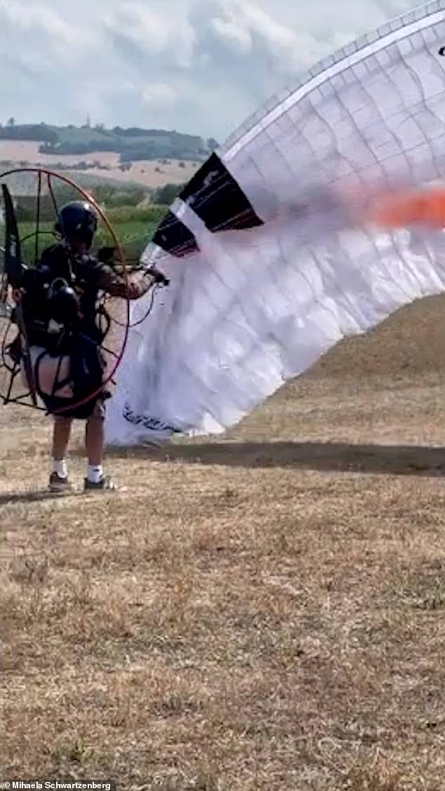 Ms Radulescu, a Romanian TV presenter, has shared chilling footage (pictured) of her long-term partner just minutes before the tragic death, tragically adding that she filmed the video 'not knowing that this would be his last flight of his extraordinary life'