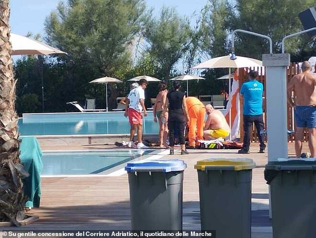 Following the fatal crash, horrified tourists and staff at Le Mimose del Club del Sole holiday village were seen crowding Baumgartner as he lay poolside in images courtesy of Corriere Adriatico, the daily newspaper of the Marche region